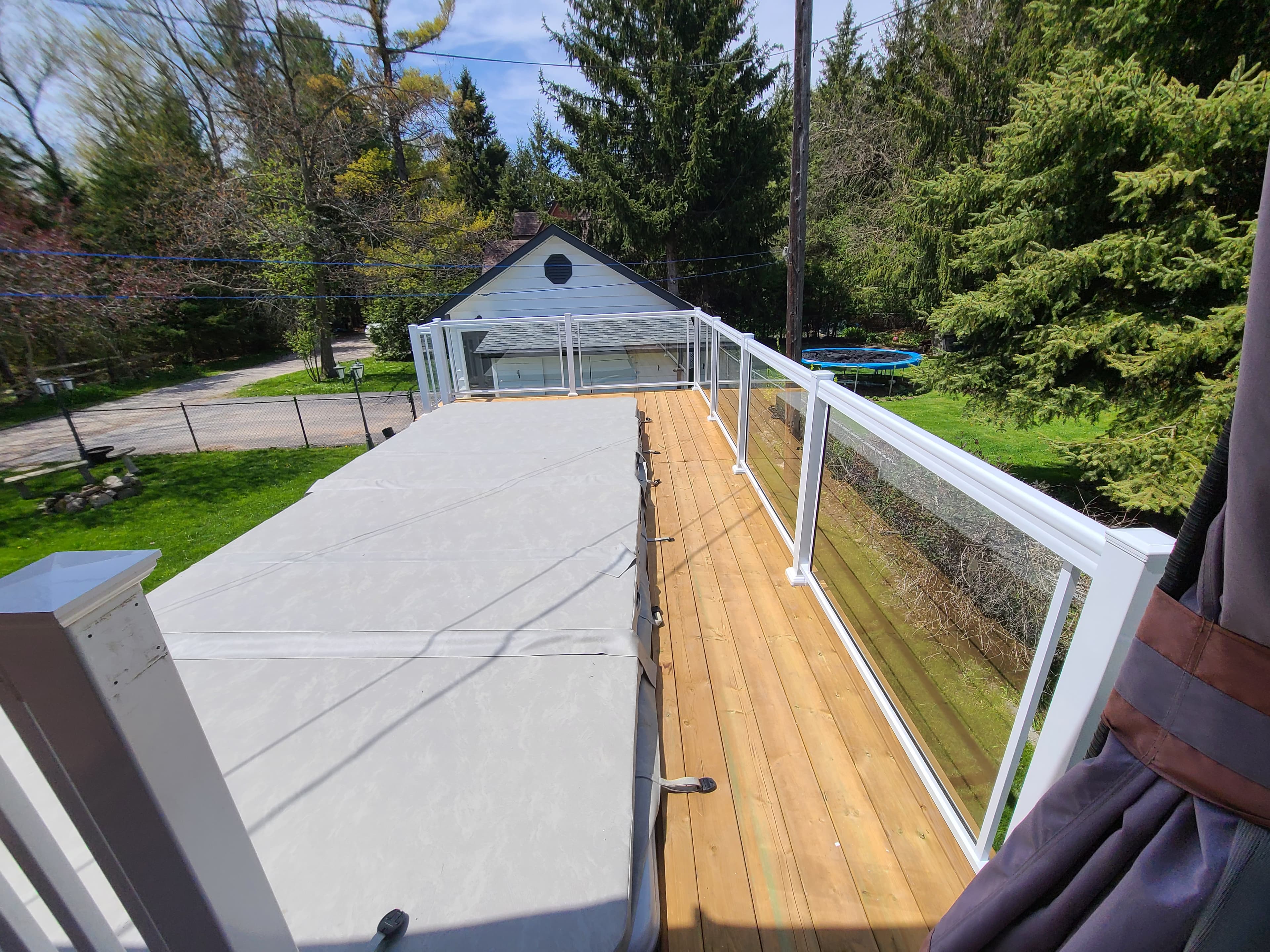 Frameless glass railing on elevated deck